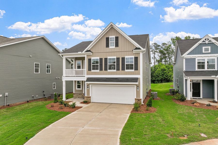 Front exterior of a new home in Renaissance at White Oak, Garner, NC, highlighting curb appeal (Image 2). Front exterior of a new home in Renaissance at White Oak, Garner, NC, highlighting curb appeal (Image 2).