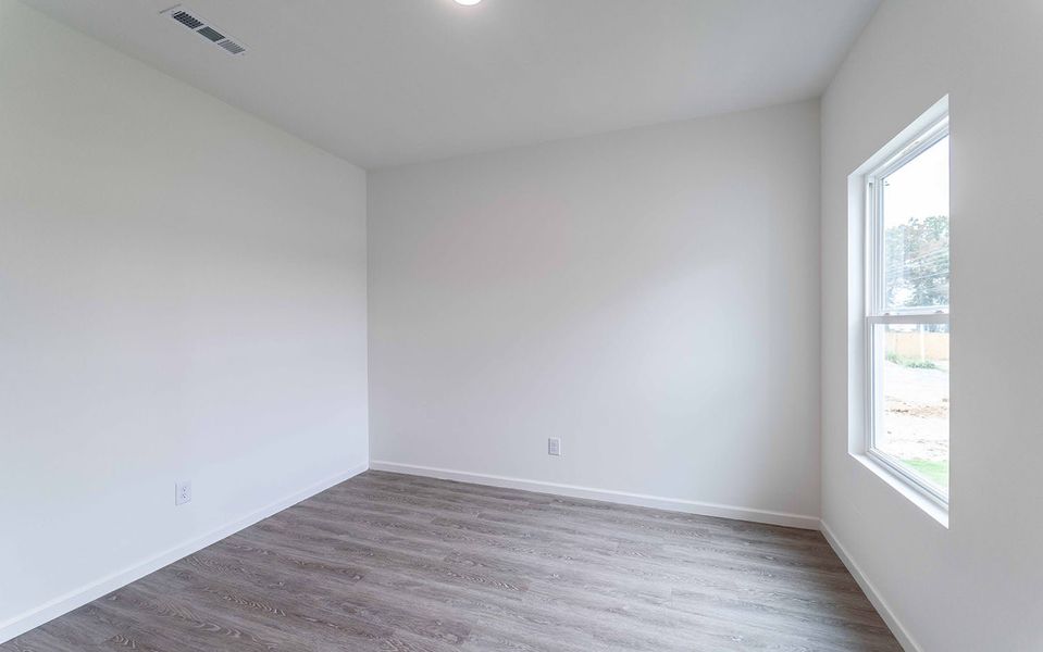 Spacious, unfurnished interior of a new home in Stonehenge, Manchester (Image 18).