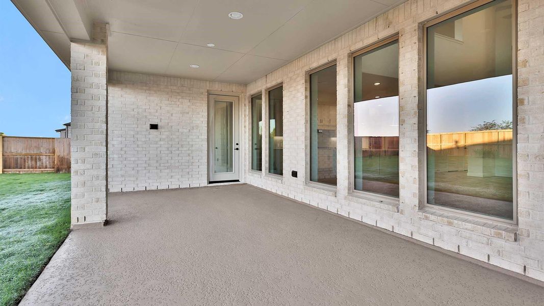 Exterior details and patio area of a home in Meridiana 80' - Gated, Manvel (Image 2). Exterior details and patio area of a home in Meridiana 80' - Gated, Manvel (Image 2).