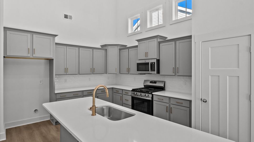 Tasteful design meets functional luxury in this kitchen with an 8-foot island