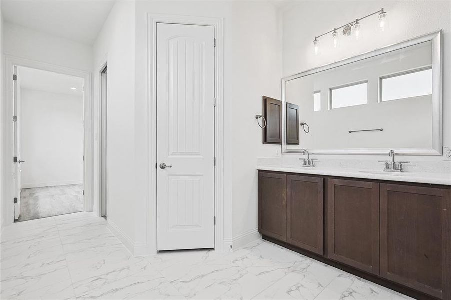 Bathroom featuring tile patterned flooring and vanity