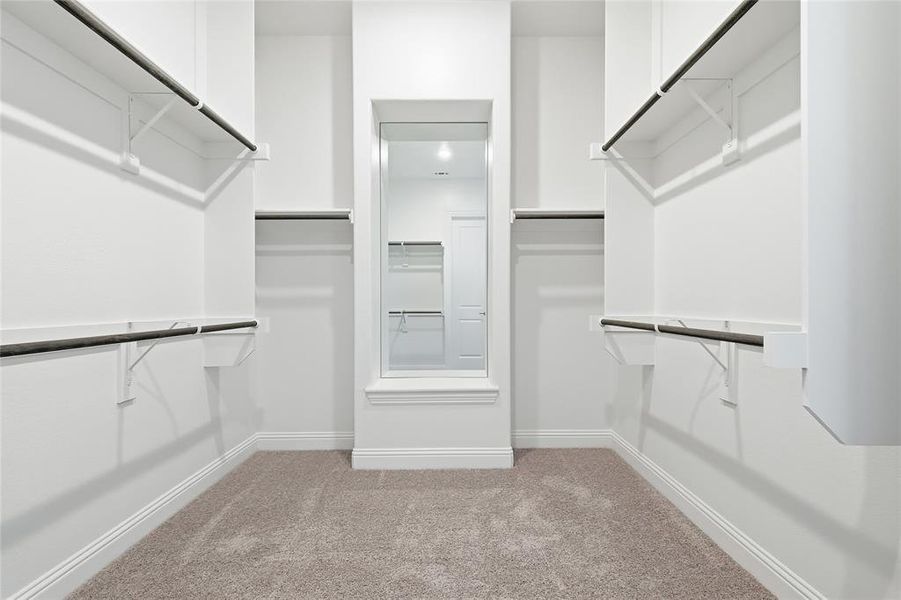 Walk in closet with light carpet Walk in closet with light carpet