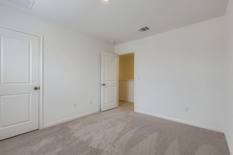 Unfurnished bedroom featuring carpet and baseboards Unfurnished bedroom featuring carpet and baseboards