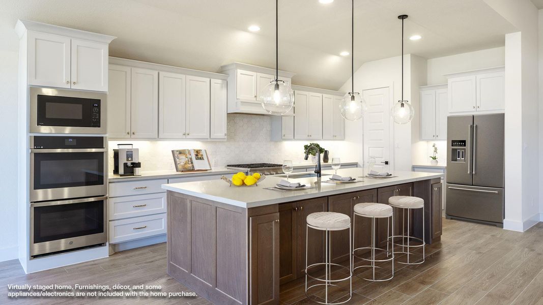 Kitchen with stainless steel appliances, light wood finished floors, decorative backsplash, white cabinets, and recessed lighting