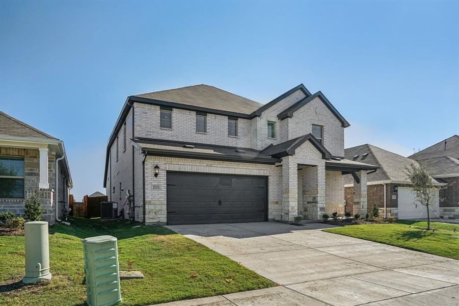 Front exterior of a new home in Stonehaven, Seagoville, TX, highlighting curb appeal (Image 2). Front exterior of a new home in Stonehaven, Seagoville, TX, highlighting curb appeal (Image 2).