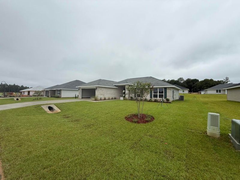 Front exterior of a new home in Ashton View, Crestview, FL, highlighting curb appeal (Image 2). Front exterior of a new home in Ashton View, Crestview, FL, highlighting curb appeal (Image 2).