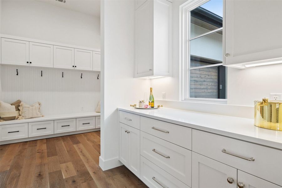 Butler Pantry Leading to oversized laundry and garage entry