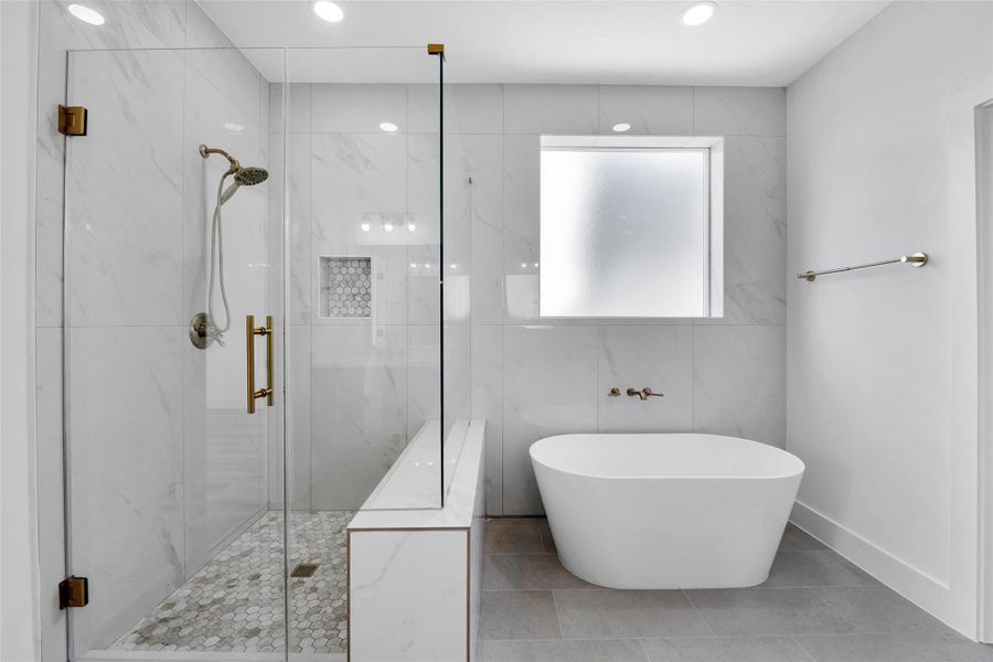 Enjoy a quick shower before work or a long soak after a day at the gym or a long hike in this bath with clean lines and beautiful finishes.