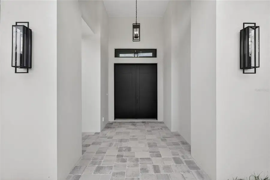 Exterior details and patio area of a home in , North Port (Image 46).