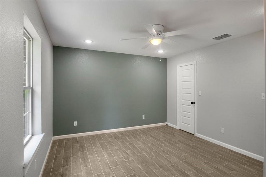 Spare room featuring a ceiling fan, wood finish floors, and recessed lighting Spare room featuring a ceiling fan, wood finish floors, and recessed lighting