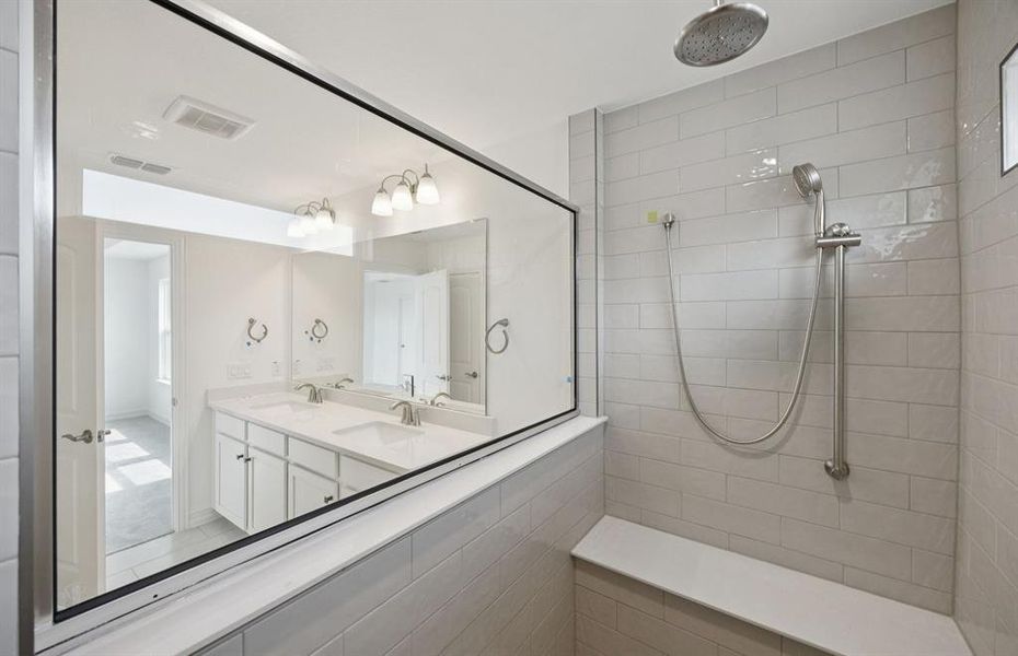 Deep walk-in shower designed for relaxation in the owner's bath *Real home pictured Deep walk-in shower designed for relaxation in the owner's bath *Real home pictured