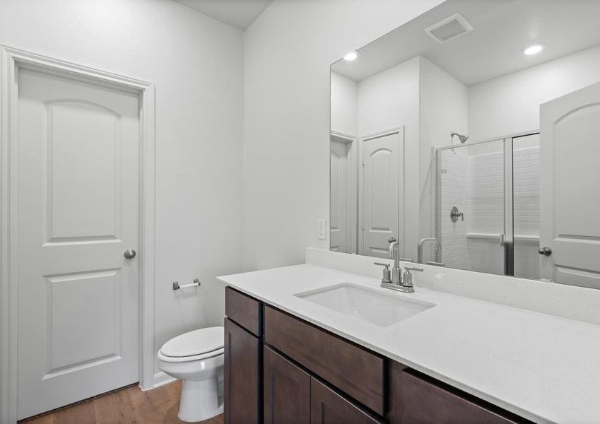 The master bathroom has a large vanity space.