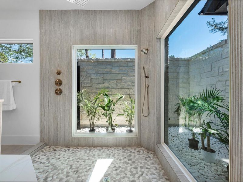 Thoughtfully designed with symmetry and scale, this spa-inspired bath offers a serene escape with high-end finishes and a calming, open layout.