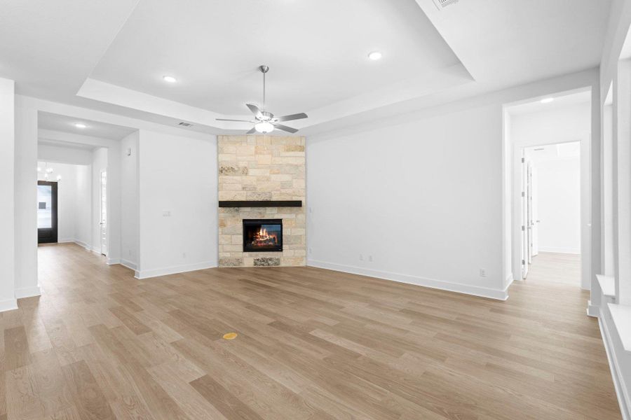 Family Room with tray ceiling & fireplace