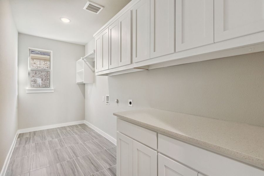 Utility Room in the Morrison home plan by Trophy Signature Homes – REPRESENTATIVE PHOTO