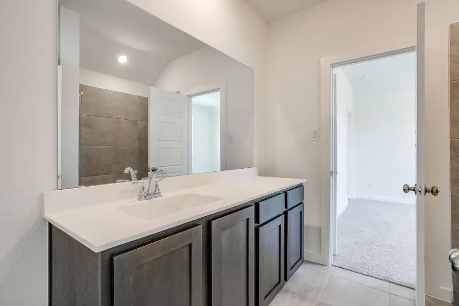 Representative furnished interior of a home built from the Palmer by Graham Hart Home Builder in Bear Ridge, Burleson (Image 4).