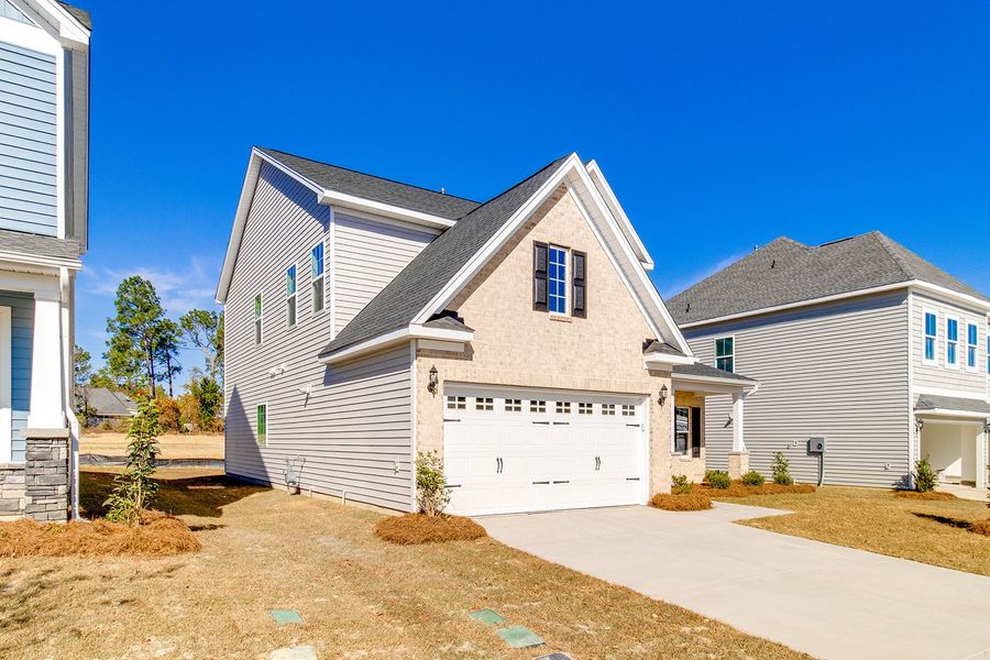 Front exterior of a new home in Hendrix Farms, Lexington, SC, highlighting curb appeal (Image 21).