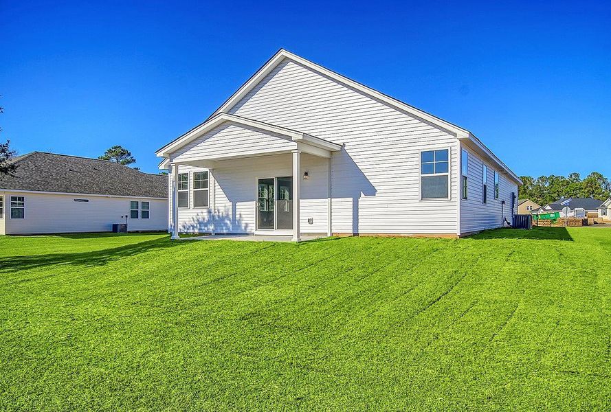 Representative exterior photo of a completed home built from the Kershaw by Hunter Quinn Homes in Palm Coast Homes, Palm Coast, FL (Image 16).