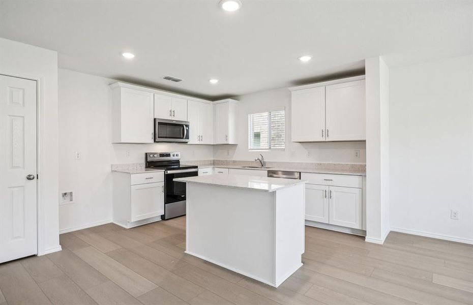 Spacious kitchen with ample cabinet space Spacious kitchen with ample cabinet space