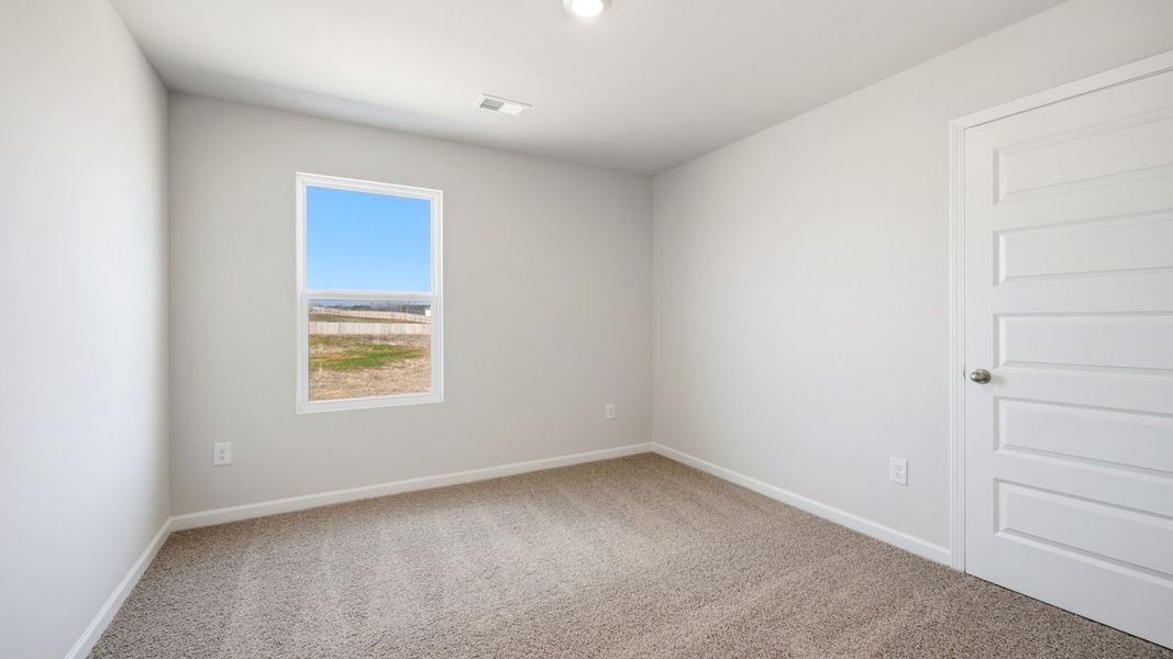 Representative unfurnished interior of a home built from the Flora by D.R. Horton in Fox Crossing, Griffin (Image 26).