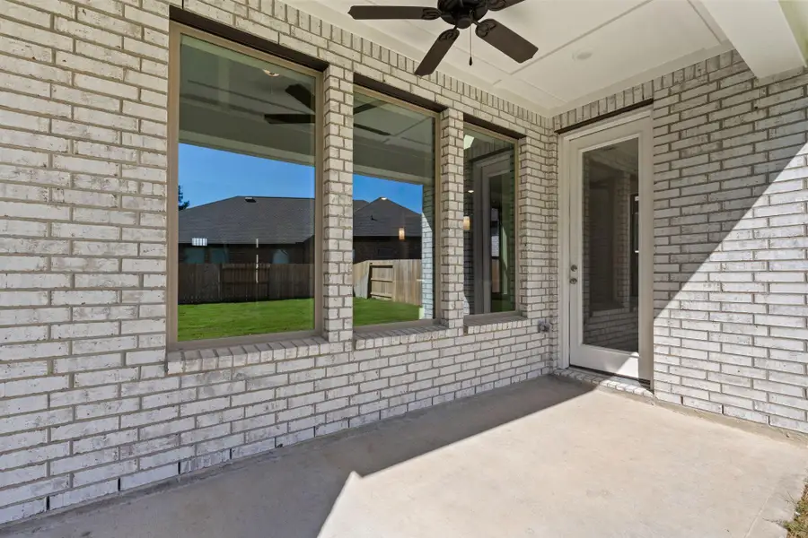 Exterior details and patio area of a home in The Trails, New Caney (Image 3).