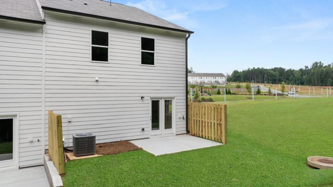 Exterior details and patio area of a home in Waypoint, Flowery Branch (Image 3).
