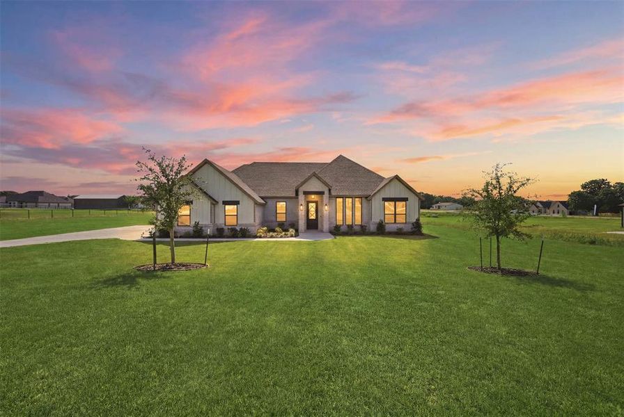 Front exterior of a new home in , Azle, TX, highlighting curb appeal (Image 1). Front exterior of a new home in , Azle, TX, highlighting curb appeal (Image 1).