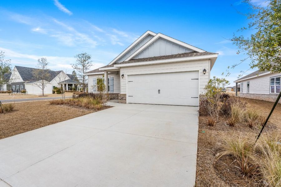 Front exterior of a new home in Natureview, Freeport, FL, highlighting curb appeal (Image 26).