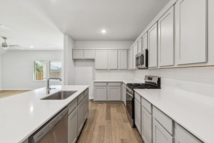 Kitchen in the Oscar home plan by Trophy Signature Homes – REPRESENTATIVE PHOTO Kitchen in the Oscar home plan by Trophy Signature Homes – REPRESENTATIVE PHOTO
