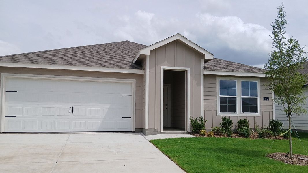 Front exterior of a new home in Wildwood, Royse City, TX, highlighting curb appeal (Image 1). Front exterior of a new home in Wildwood, Royse City, TX, highlighting curb appeal (Image 1).