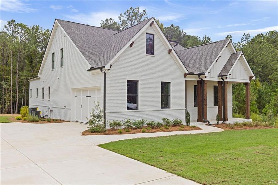 Front exterior of a new home in , Watkinsville, GA, highlighting curb appeal (Image 28). Front exterior of a new home in , Watkinsville, GA, highlighting curb appeal (Image 28).