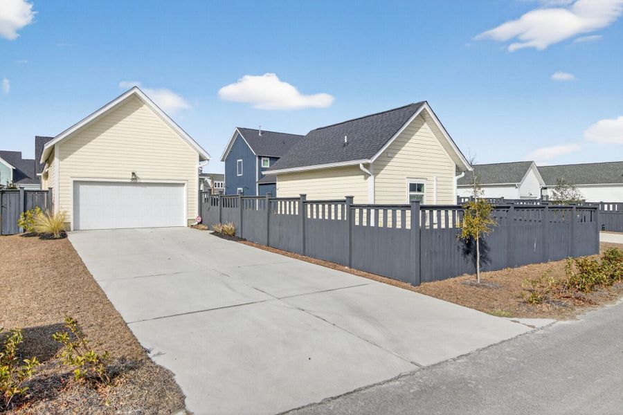 Front exterior of a new home in The Domus Collection at Midtown Nexton, Summerville, SC, highlighting curb appeal (Image 2). Front exterior of a new home in The Domus Collection at Midtown Nexton, Summerville, SC, highlighting curb appeal (Image 2).