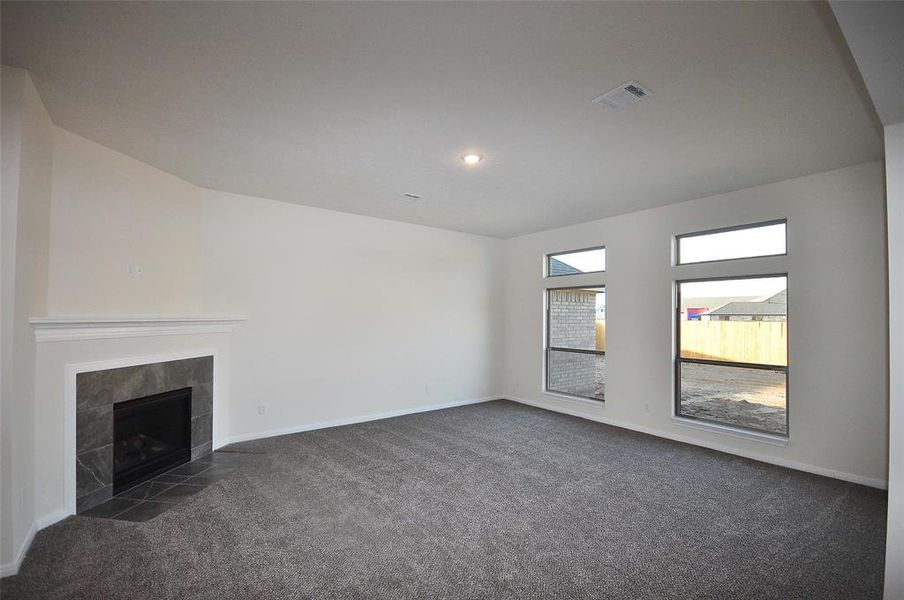 Family Room with Directly vented and remotely controlled gas fireplace.