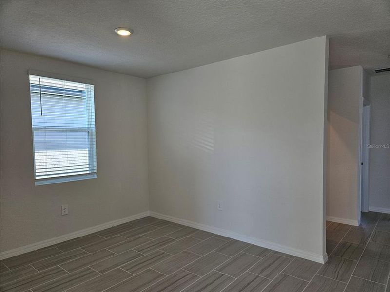 Spacious, unfurnished interior of a new home in Lawson Dunes - Signature Series, Haines City (Image 38).