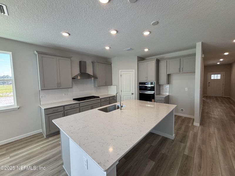 Furnished interior view inside a new home in The Magnolia Series at Reserve East, Flagler Beach (Image 7).