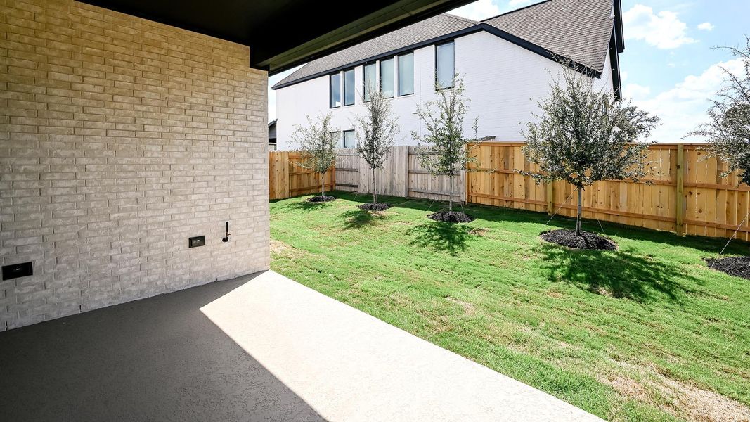 Fenced backyard featuring a patio area Fenced backyard featuring a patio area