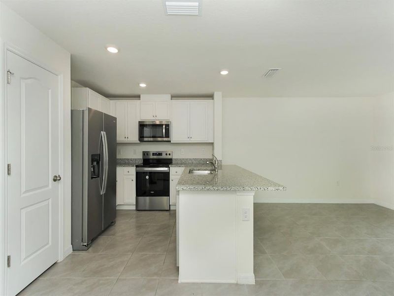 Furnished interior view inside a new home in , Harmony (Image 7).