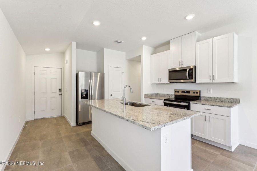 Furnished interior view inside a new home in Flagler Village - Classic Series, Palm Coast (Image 13).