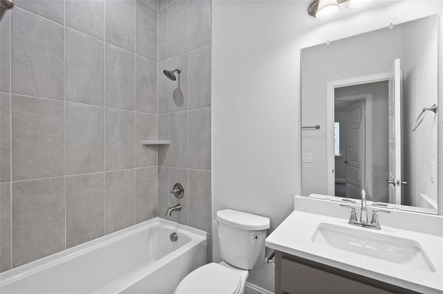 Bathroom with shower / tub combination and vanity