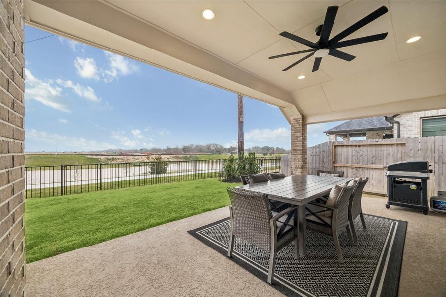 Enjoy your morning coffee under the covered patio with lakes views.