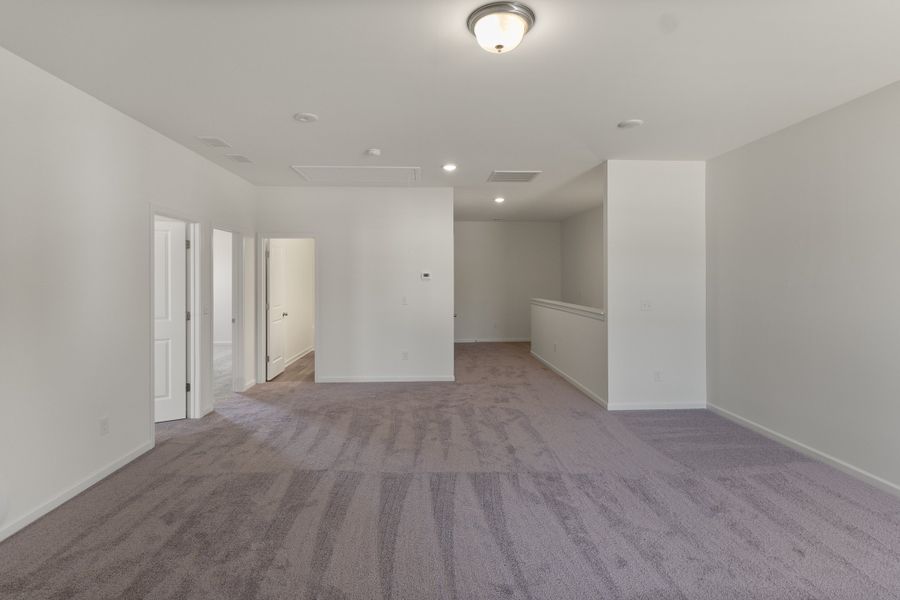 Spacious, unfurnished interior of a new home in The Exchange, Vass (Image 25).