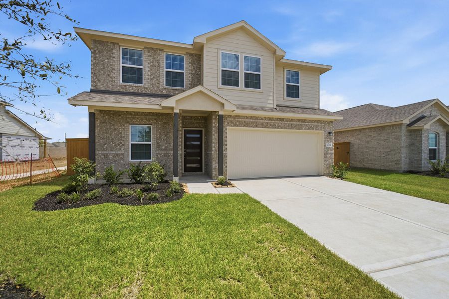 Front exterior of a new home in Sierra Vista, Rosharon, TX, highlighting curb appeal (Image 2). Front exterior of a new home in Sierra Vista, Rosharon, TX, highlighting curb appeal (Image 2).