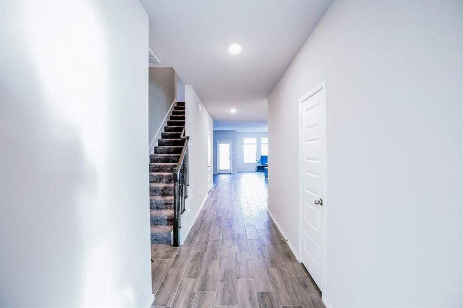 Hallway with light wood-type flooring