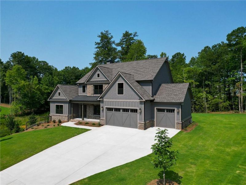 Front exterior of a new home in Spring Creek, Monroe, GA, highlighting curb appeal (Image 25). Front exterior of a new home in Spring Creek, Monroe, GA, highlighting curb appeal (Image 25).