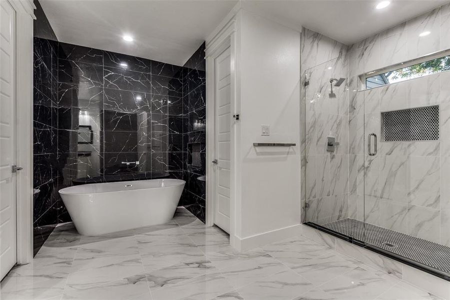 View of Bathroom when you walk in through the French doors.  Free Standing Tup tiled on all three sides and a massif shower with a frameless shower!!!