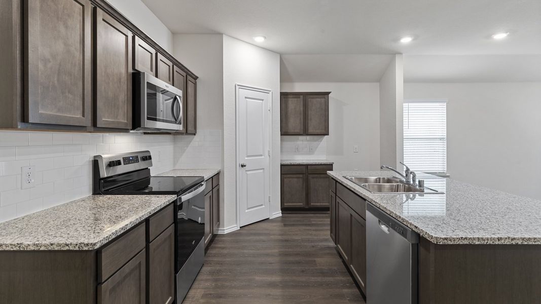 Representative furnished interior of a home built from the X40L Lakeway by D.R. Horton in Valor Farms, Royse City (Image 14).