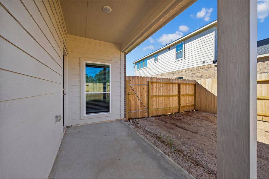 Exterior details and patio area of a home in Enclave at Willis, Willis (Image 17).