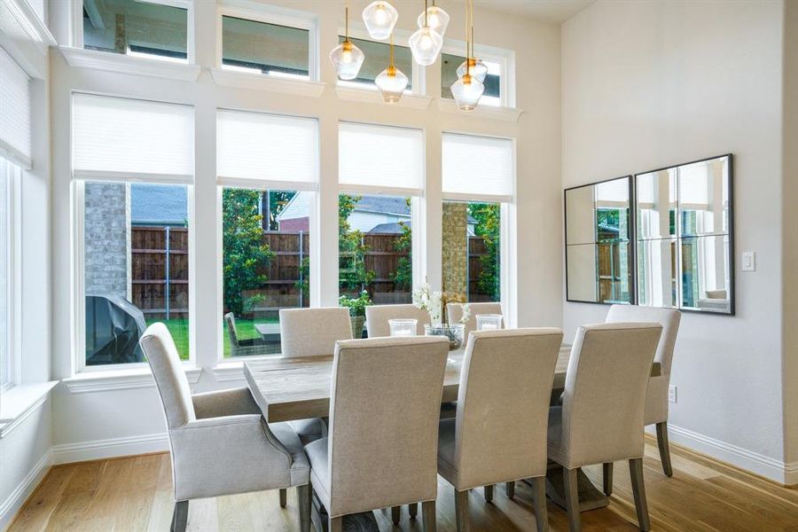 Dining with a View - Surrounded by tall windows and saturated in natural light, this dining area brings the outdoors in while maintaining a cozy sense of privacy. Dining with a View - Surrounded by tall windows and saturated in natural light, this dining area brings the outdoors in while maintaining a cozy sense of privacy.