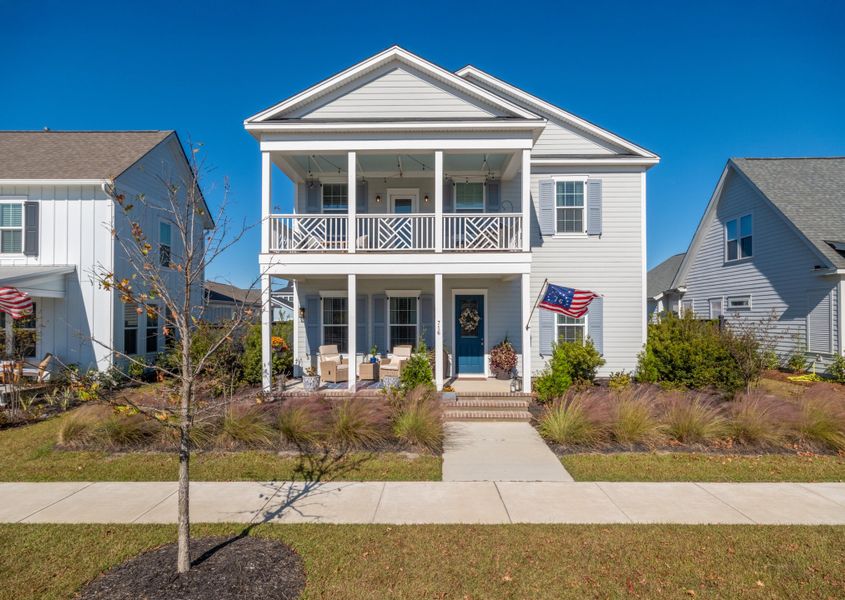Front exterior of a new home in Midtown at Nexton, Summerville, SC, highlighting curb appeal (Image 1). Front exterior of a new home in Midtown at Nexton, Summerville, SC, highlighting curb appeal (Image 1).