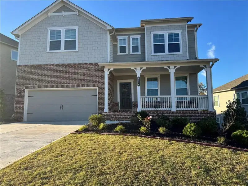 Front exterior of a new home in Stratford Hills, Ball Ground, GA, highlighting curb appeal (Image 22). Front exterior of a new home in Stratford Hills, Ball Ground, GA, highlighting curb appeal (Image 22).